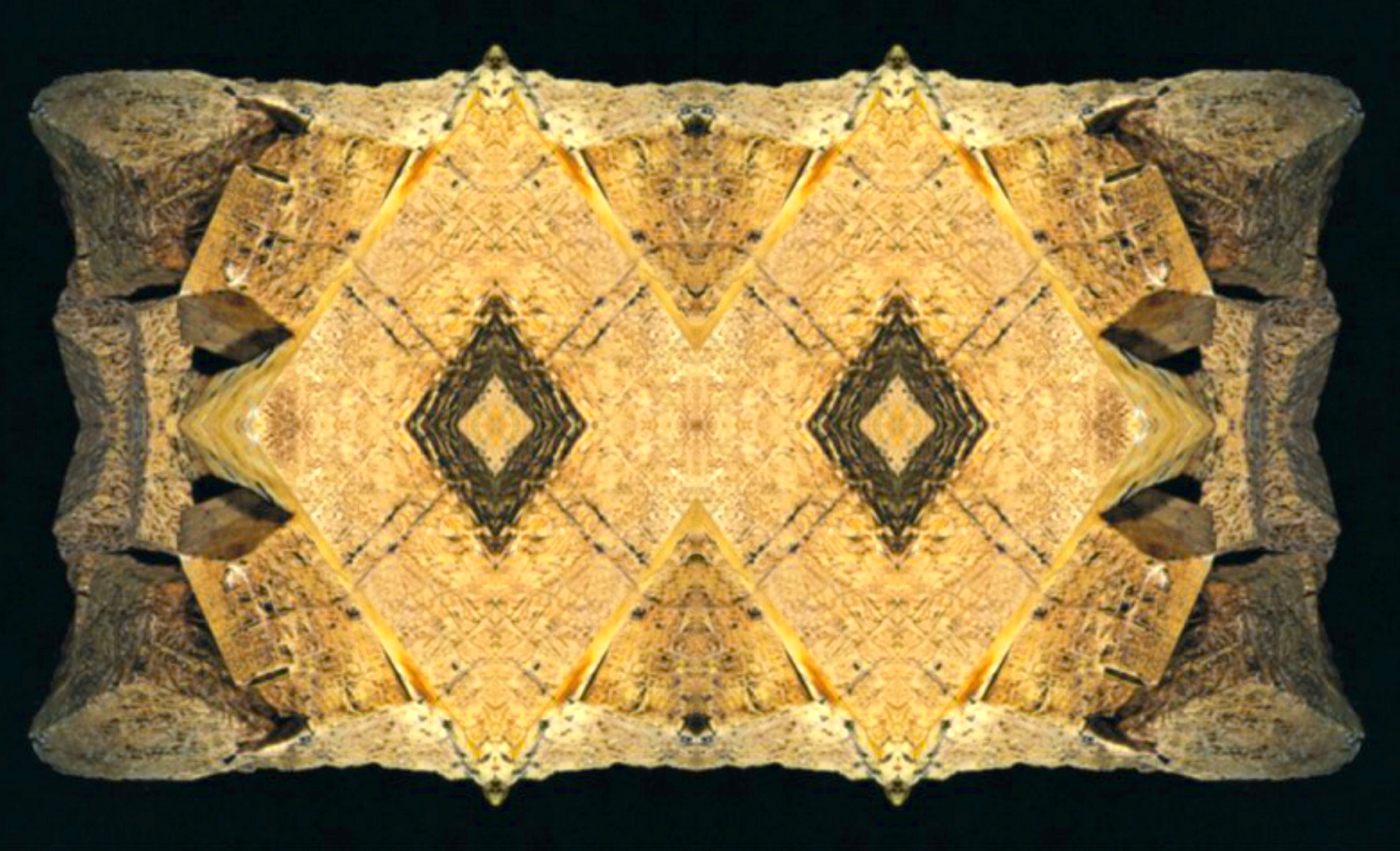 mirrored yellow trianglar shapes, either wood or clay tablets